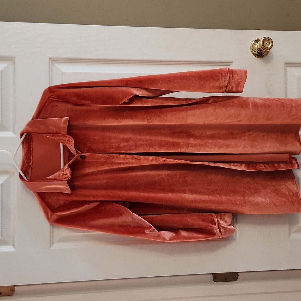Orange, velour swing shirt with pockets. Hangs below hips. size M